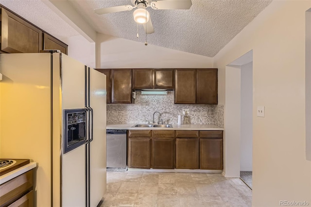 kitchen with backsplash, vaulted ceiling, stainless steel dishwasher, white fridge with ice dispenser, and a sink