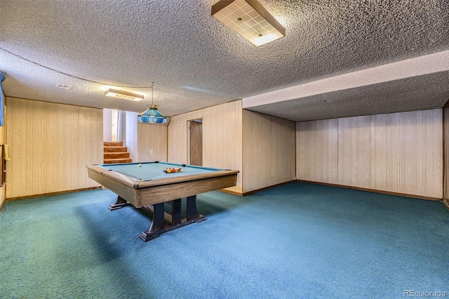 playroom featuring carpet floors, a textured ceiling, wooden walls, billiards, and baseboards