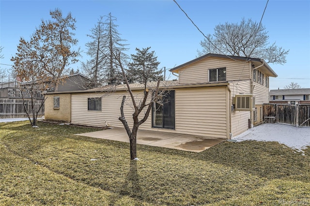 back of house featuring a yard, fence, and a patio