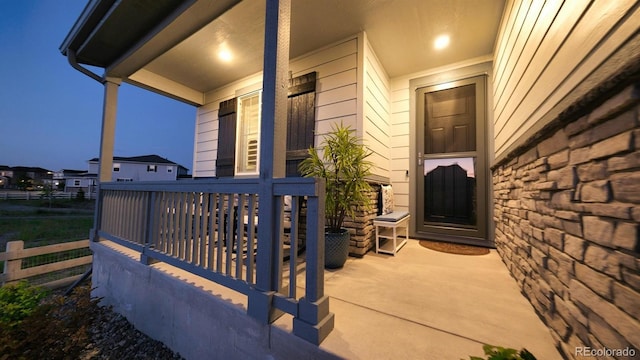 27994 E Indore Dr, Aurora, CO 80016 - view of exterior entry with a porch