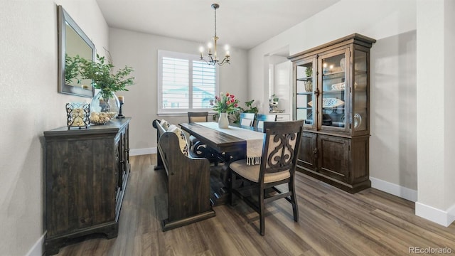27994 E Indore Dr, Aurora, CO 80016 - dining room featuring a chandelier and dark wood-style floors