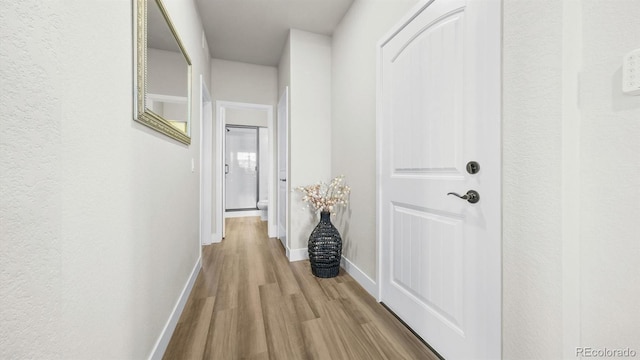 27994 E Indore Dr, Aurora, CO 80016 - corridor featuring wood finished floors and baseboards