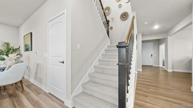27994 E Indore Dr, Aurora, CO 80016 - stairs featuring wood finished floors and recessed lighting
