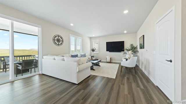 27994 E Indore Dr, Aurora, CO 80016 - living area featuring dark wood finished floors and recessed lighting