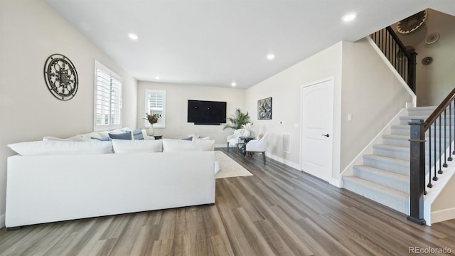 27994 E Indore Dr, Aurora, CO 80016 - living room with wood finished floors, stairs, and recessed lighting