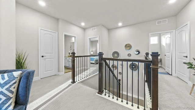 27994 E Indore Dr, Aurora, CO 80016 - corridor featuring an upstairs landing, carpet floors, and recessed lighting