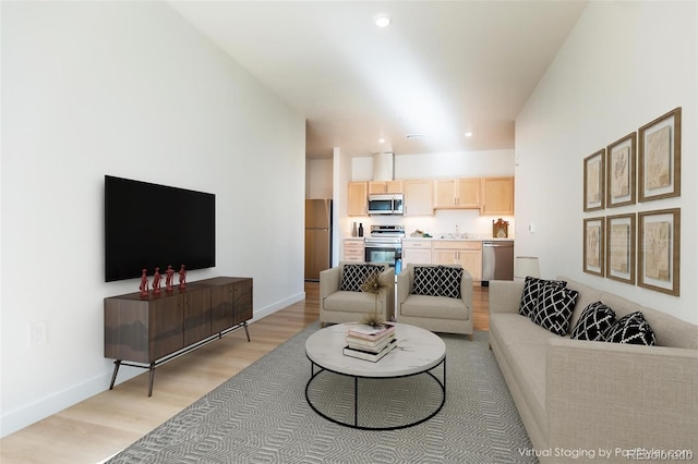 living room with light hardwood / wood-style floors