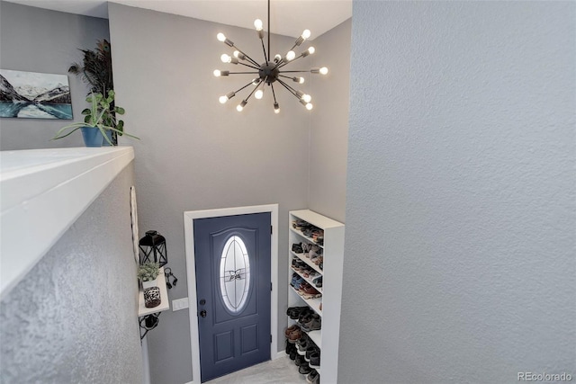 foyer featuring a notable chandelier