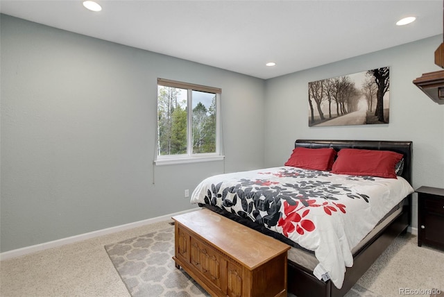 bedroom with recessed lighting, baseboards, and light carpet