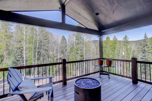 wooden terrace with a forest view