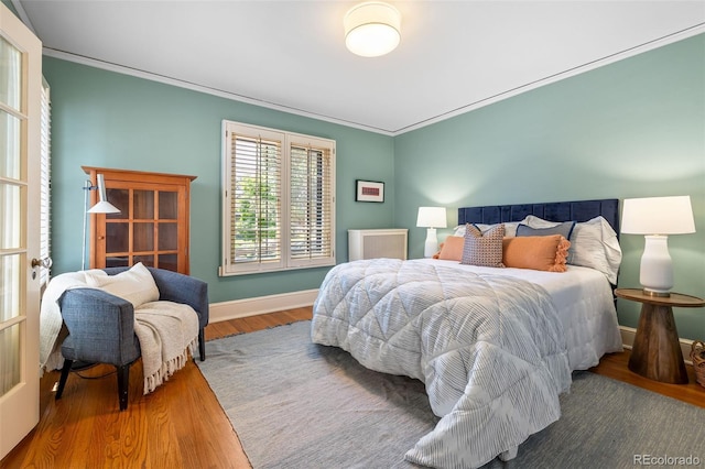 810 Milwaukee St, Denver, CO 80206 - bedroom with wood finished floors and crown molding