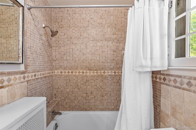 810 Milwaukee St, Denver, CO 80206 - bathroom featuring tile walls and shower / bath combo