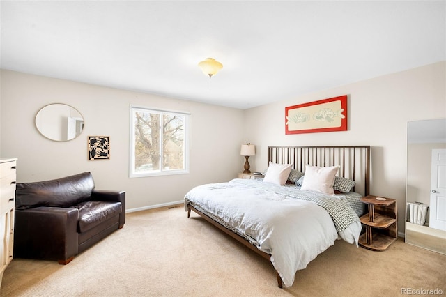 carpeted bedroom with baseboards