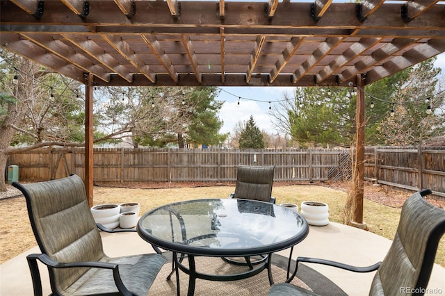 view of patio featuring a fenced backyard, outdoor dining space, and a pergola