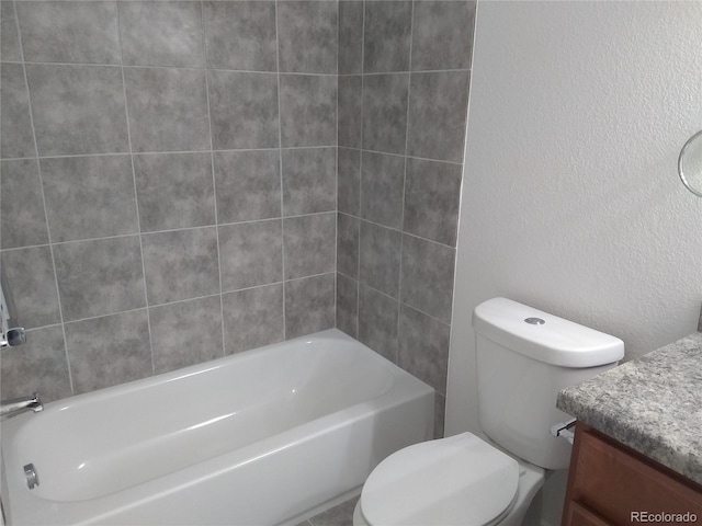 full bathroom with tiled shower / bath combo, vanity, and toilet