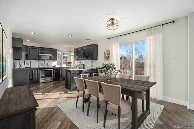 dining space with dark wood-type flooring