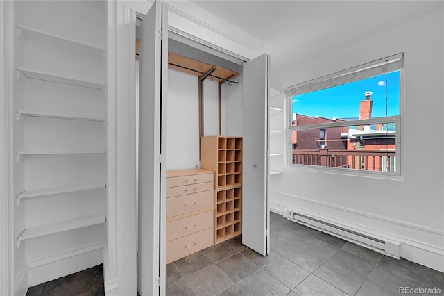 closet featuring baseboard heating