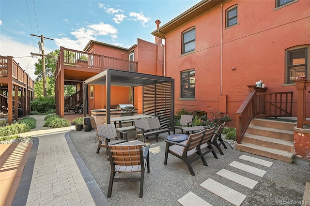 view of patio featuring an outdoor hangout area and stairs