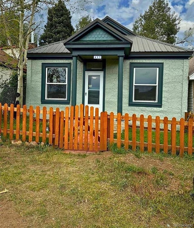 417 E Eaton Ave, Cripple Creek, CO 80813 - view of front facade with stucco siding and a metal roof