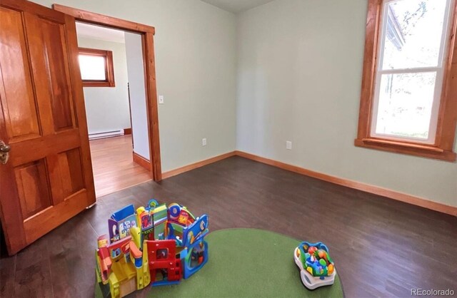 417 E Eaton Ave, Cripple Creek, CO 80813 - game room featuring dark wood finished floors and baseboard heating