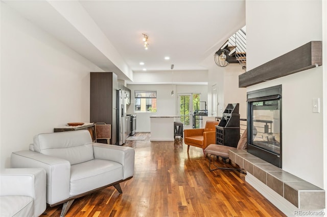 2325 Walnut St Unit 4, Denver, CO 80205 - living area with wood finished floors and a tile fireplace