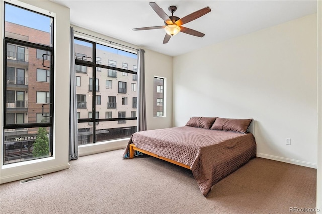 2325 Walnut St Unit 4, Denver, CO 80205 - carpeted bedroom with baseboards and a ceiling fan