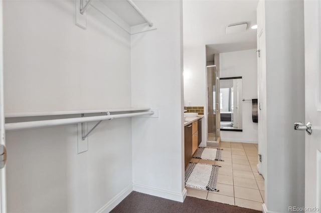 2325 Walnut St Unit 4, Denver, CO 80205 - walk in closet with light tile patterned flooring