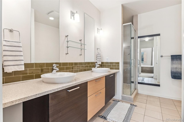 2325 Walnut St Unit 4, Denver, CO 80205 - full bathroom featuring double vanity, a stall shower, tile patterned flooring, decorative backsplash, and baseboards