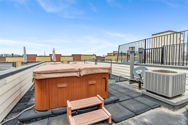 2325 Walnut St Unit 4, Denver, CO 80205 - view of patio with central air condition unit and a hot tub