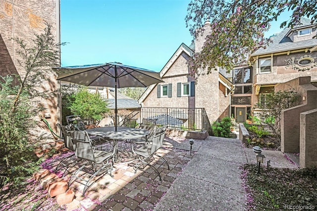 view of patio featuring outdoor dining area