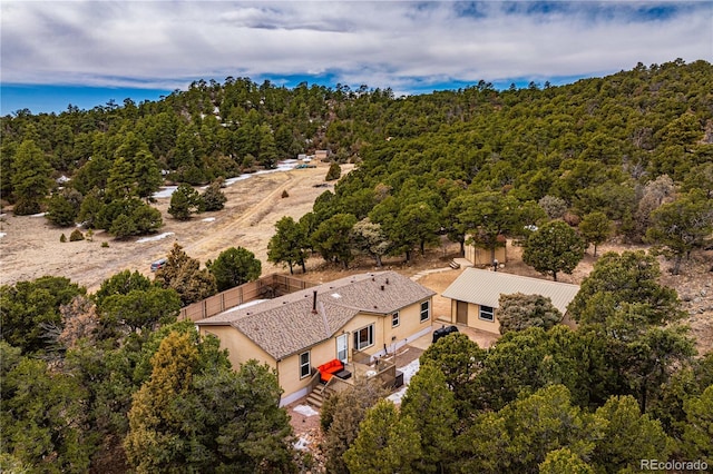 aerial view with a wooded view