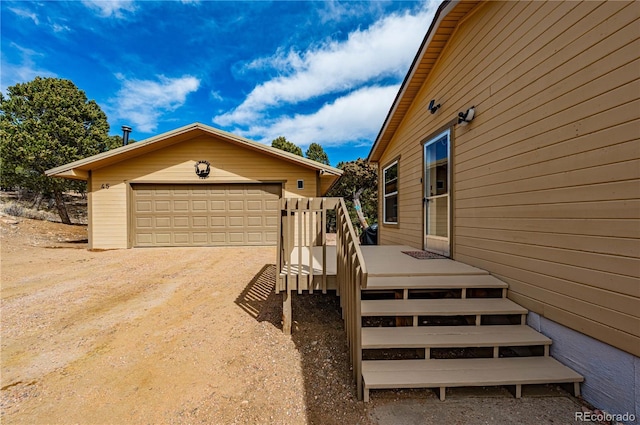 exterior space featuring an outbuilding and a detached garage