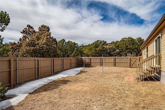 view of yard with a fenced backyard