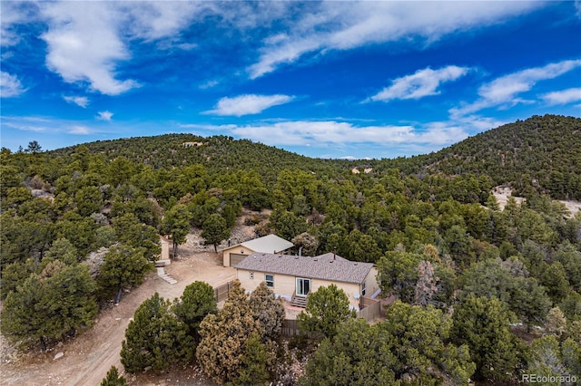 aerial view featuring a forest view