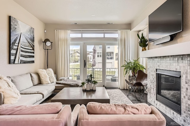 15576 W Washburn Cir, Lakewood, CO 80228 - living room featuring a tiled fireplace