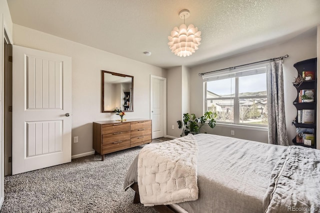 15576 W Washburn Cir, Lakewood, CO 80228 - carpeted bedroom with baseboards and a textured ceiling