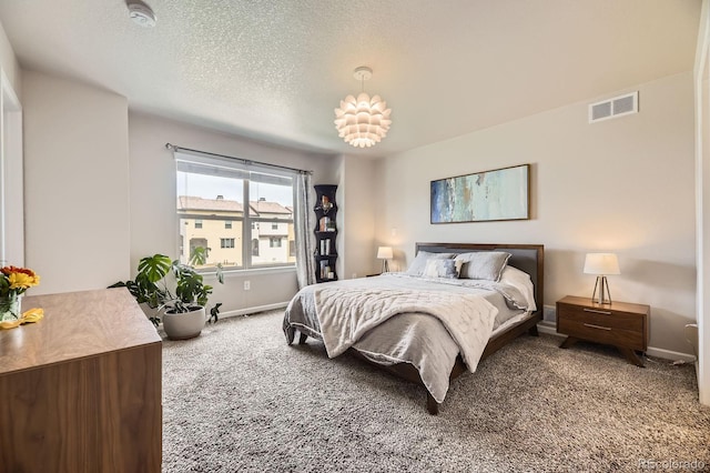 15576 W Washburn Cir, Lakewood, CO 80228 - bedroom with carpet floors, baseboards, and a textured ceiling