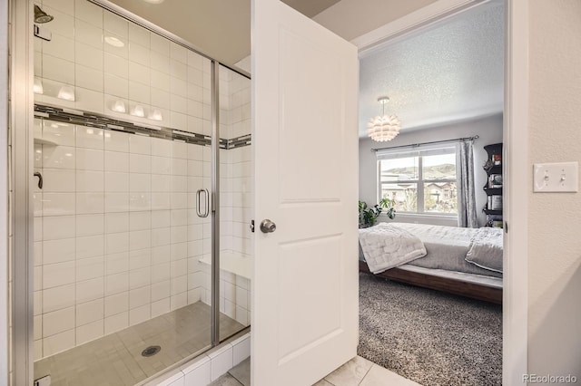 15576 W Washburn Cir, Lakewood, CO 80228 - ensuite bathroom featuring a stall shower and a textured ceiling