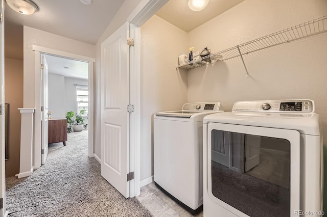 15576 W Washburn Cir, Lakewood, CO 80228 - laundry room with separate washer and dryer, light colored carpet, and baseboards