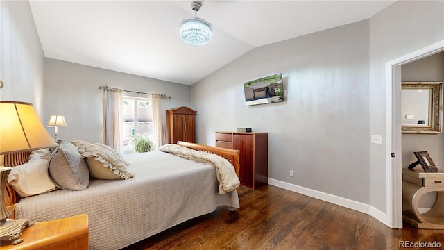 6945 N Fargo Trl, Littleton, CO 80125 - bedroom featuring baseboards, dark wood finished floors, and vaulted ceiling