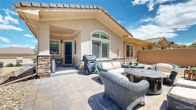 6945 N Fargo Trl, Littleton, CO 80125 - view of patio / terrace with a grill, outdoor lounge area, and fence