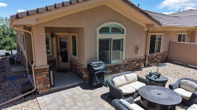 6945 N Fargo Trl, Littleton, CO 80125 - view of patio / terrace with central air condition unit, a grill, and an outdoor hangout area