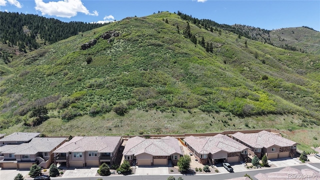 6945 N Fargo Trl, Littleton, CO 80125 - aerial perspective of suburban area featuring a forest and a mountain backdrop