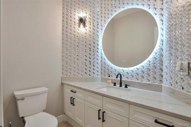 bathroom with vanity and toilet