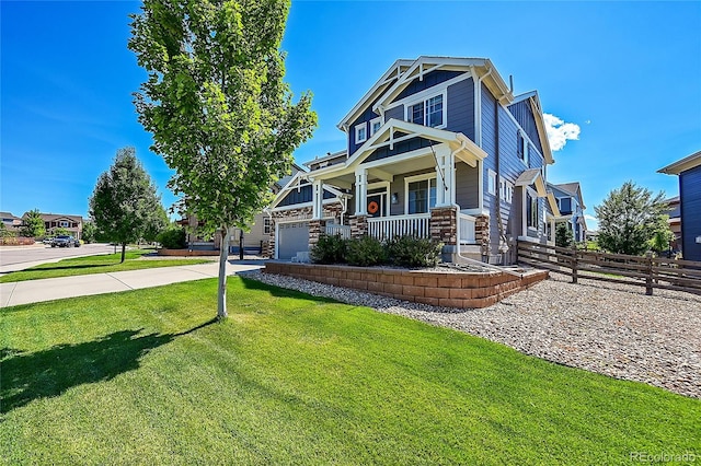 craftsman-style house featuring a porch, a garage, and a front lawn