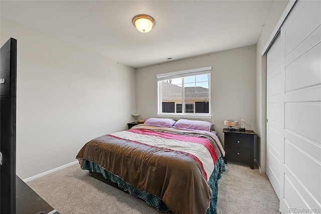 carpeted bedroom featuring a closet