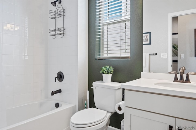 full bathroom with vanity, toilet, and tiled shower / bath