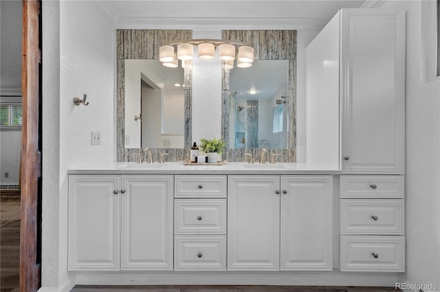 6243 S Elati St, Littleton, CO 80120 - bathroom with a shower stall, double vanity, and crown molding