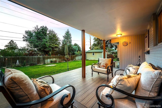 6243 S Elati St, Littleton, CO 80120 - wooden deck featuring a fenced backyard, an outdoor living space, and a shed