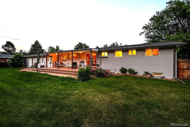 6243 S Elati St, Littleton, CO 80120 - rear view of house featuring brick siding